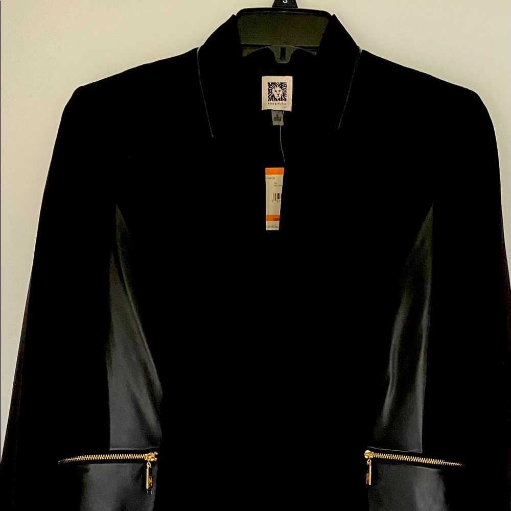 Blazer faux leather and polyester. Never worn